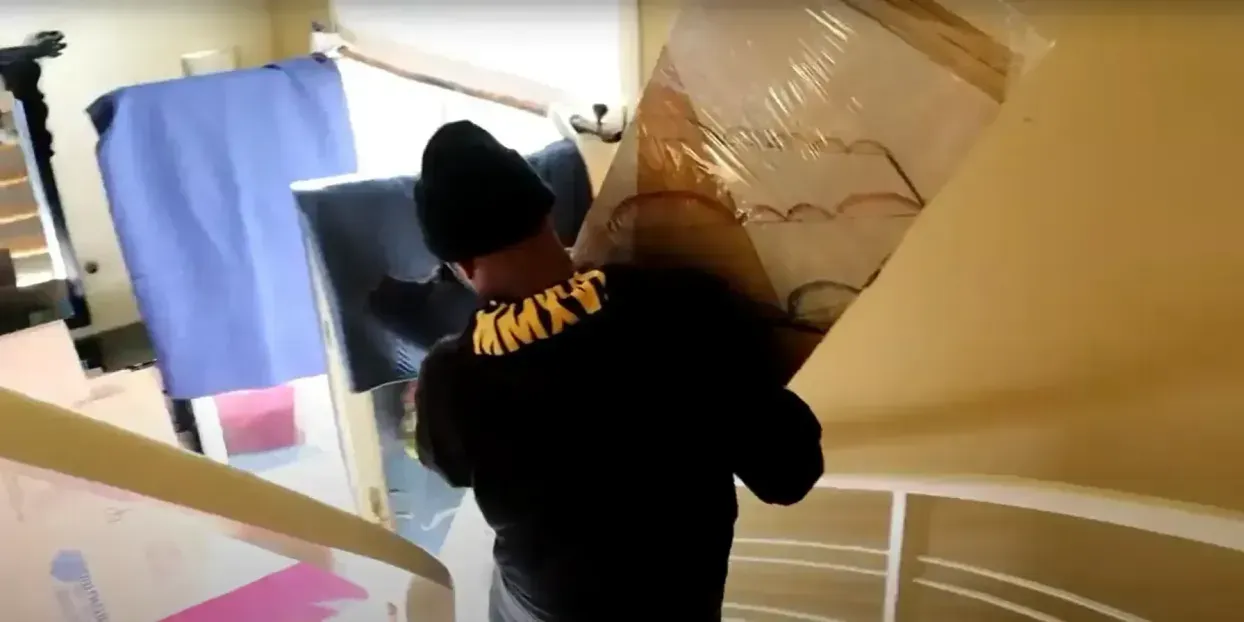 Professional movers carrying boxes